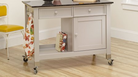 Taupe colored kitchen island on caster wheels